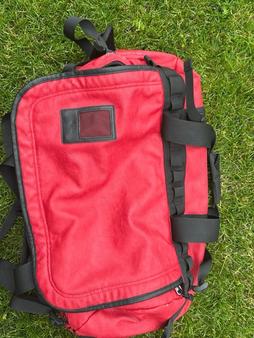 The North Face x Supreme Red Duffel Bag with Black Straps